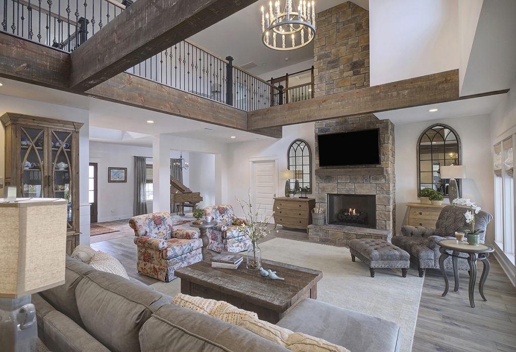 Traditional English living room withwonderful textures such as the stone fireplace and wood beams